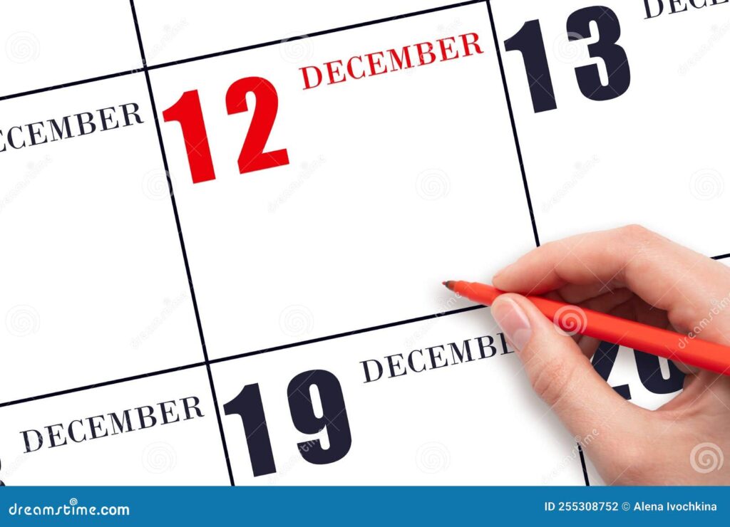 maos segurando um calendario de dezembro